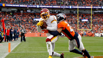 DENVER, COLORADO - OCTOBER 31: DeAndre Carter #1 of the Washington Football Team makes a catch for a touchdown while being guarded by Bryce Callahan #29 of the Denver Broncos in the third quarter at Empower Field At Mile High on October 31, 2021 in Denver, Colorado. (Photo by Justin Edmonds/Getty Images)