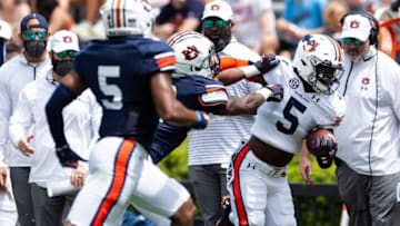 Auburn wide receiver Kobe Hudson (5) runs the ball after a catch during Auburn football A-Day spring game at Jordan-Hare Stadium in Auburn, Ala., on Saturday, April 17, 2021.
