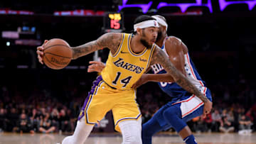 LOS ANGELES, CALIFORNIA - JANUARY 29: Brandon Ingram #14 of the Los Angeles Lakers spins from Corey Brewer #00 of the Philadelphia 76ers during a 121-105 76ers win at Staples Center on January 29, 2019 in Los Angeles, California. NOTE TO USER: User expressly acknowledges and agrees that, by downloading and or using this photograph, User is consenting to the terms and conditions of the Getty Images License Agreement. (Photo by Harry How/Getty Images)