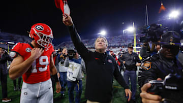 ATLANTA, GEORGIA - NOVEMBER 25: Head coach Kirby Smart leaves the field with Brock Bowers #19 of the Georgia Bulldogs following the 31-23 victory over the Georgia Tech Yellow Jackets at Bobby Dodd Stadium on November 25, 2023 in Atlanta, Georgia. (Photo by Todd Kirkland/Getty Images)