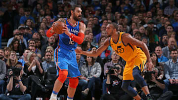 OKLAHOMA CITY, OK- FEBRUARY 22: Steven Adams #12 of the Oklahoma City Thunder handles the ball against Rudy Gobert #27 of the Utah Jazz on February 22, 2019 at Chesapeake Energy Arena in Oklahoma City, Oklahoma. Copyright 2019 NBAE (Photo by Zach Beeker/NBAE via Getty Images)