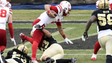 Dec 5, 2020; West Lafayette, Indiana, USA; Nebraska Cornhuskers quarterback Adrian Martinez (2) is tackled by Purdue Boilermakers linebacker Kieren Douglas (43) during the first quarter of the game at Ross-Ade Stadium. Mandatory Credit: Marc Lebryk-USA TODAY Sports