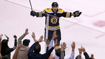 BOSTON - JANUARY 23: Boston Bruins' Brad Marchand (63) celebrates his second period goal with fans. The Boston Bruins host the New Jersey Devils in a regular season NHL hockey game at TD Garden in Boston on Jan. 23, 2018. (Photo by Jim Davis/The Boston Globe via Getty Images)