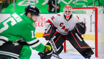 Apr 27, 2021; Dallas, Texas, USA; Carolina Hurricanes goaltender Alex Nedeljkovic (39) faces a shot by Dallas Stars left wing Blake Comeau (15) during the third period at the American Airlines Center. Mandatory Credit: Jerome Miron-USA TODAY Sports
