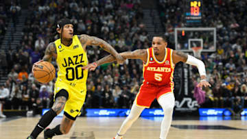 SALT LAKE CITY, UTAH - FEBRUARY 03: Jordan Clarkson #00 of the Utah Jazz drives around Dejounte Murray #5 of the Atlanta Hawks during the first half of a game at Vivint Arena on February 03, 2023 in Salt Lake City, Utah. NOTE TO USER: User expressly acknowledges and agrees that, by downloading and or using this photograph, User is consenting to the terms and conditions of the Getty Images License Agreement. (Photo by Alex Goodlett/Getty Images)