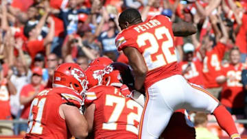 Sep 11, 2016; Kansas City, MO, USA; Kansas City Chiefs quarterback Alex Smith (11) is congratulated after scoring the winning touchdown in overtime against the San Diego Chargers at Arrowhead Stadium. Kansas City won 33-27. Mandatory Credit: John Rieger-USA TODAY Sports