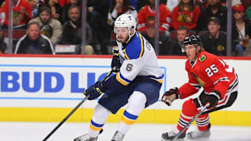 Apr 7, 2016; Chicago, IL, USA; St. Louis Blues defenseman Joel Edmundson (6) is pursued by Chicago Blackhawks right wing Dale Weise (25) during the first period at the United Center. Mandatory Credit: Dennis Wierzbicki-USA TODAY Sports