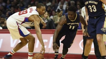 Jan 10, 2016; Los Angeles, CA, USA; Los Angeles Clippers forward Wesley Johnson (left) steals the ball from New Orleans Pelicans guard Jrue Holiday (center) during the first quarter at Staples Center. Mandatory Credit: Kelvin Kuo-USA TODAY Sports