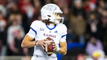 LUBBOCK, TEXAS - NOVEMBER 12: Quarterback Jason Bean #9 of the Kansas Jayhawks looks to pass during the first half of the game against the Texas Tech Red Raiders at Jones AT&T Stadium on November 12, 2022 in Lubbock, Texas. (Photo by John E. Moore III/Getty Images)