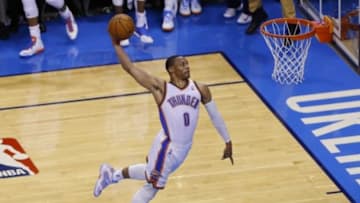 May 25, 2014; Oklahoma City, OK, USA; Oklahoma City Thunder guard Russell Westbrook (0) goes up for a dunk against the San Antonio Spurs in game three of the Western Conference Finals of the 2014 NBA Playoffs at Chesapeake Energy Arena. Oklahoma City won 106-97. Mandatory Credit: Alonzo Adams-USA TODAY Sports