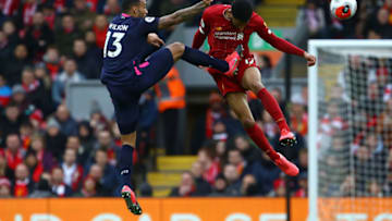Bournemouth's English striker Callum Wilson (L) vies with Liverpool's English defender Joe Gomez during the English Premier League football match between Liverpool and Bournemouth at Anfield in Liverpool, north west England on March 7, 2020. (Photo by GEOFF CADDICK / AFP) / RESTRICTED TO EDITORIAL USE. No use with unauthorized audio, video, data, fixture lists, club/league logos or 'live' services. Online in-match use limited to 120 images. An additional 40 images may be used in extra time. No video emulation. Social media in-match use limited to 120 images. An additional 40 images may be used in extra time. No use in betting publications, games or single club/league/player publications. / (Photo by GEOFF CADDICK/AFP via Getty Images)
