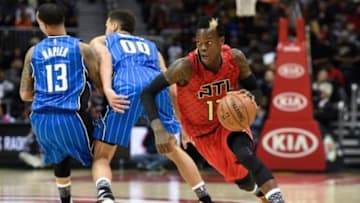 Jan 18, 2016; Atlanta, GA, USA; Atlanta Hawks guard Dennis Schroder (17) dribbles around Orlando Magic forward Aaron Gordon (00) and guard Shabazz Napier (13) during the second half at Philips Arena. The Hawks defeated the Magic 98-81. Mandatory Credit: Dale Zanine-USA TODAY Sports
