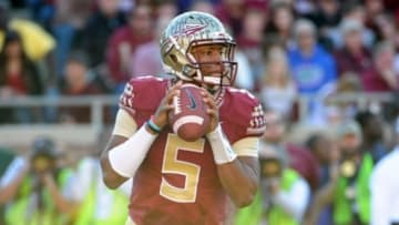 Nov 29, 2014; Tallahassee, FL, USA; Florida State Seminoles quarterback Jameis Winston (5) looks to throw the ball during the first half of the game against the Florida Gators at Doak Campbell Stadium. Mandatory Credit: Melina Vastola-USA TODAY Sports