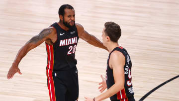 LAKE BUENA VISTA, FLORIDA - SEPTEMBER 27: Duncan Robinson #55 of the Miami Heat reacts to a three point basket with Andre Iguodala #28 of the Miami Heat during the fourth quarter in Game Six of the Eastern Conference Finals during the 2020 NBA Playoffs at AdventHealth Arena at the ESPN Wide World Of Sports Complex on September 27, 2020 in Lake Buena Vista, Florida. NOTE TO USER: User expressly acknowledges and agrees that, by downloading and or using this photograph, User is consenting to the terms and conditions of the Getty Images License Agreement. (Photo by Kevin C. Cox/Getty Images)