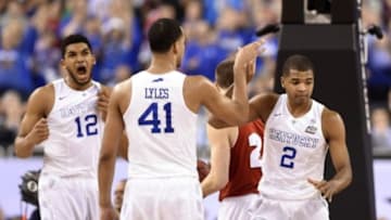 Apr 4, 2015; Indianapolis, IN, USA; Kentucky Wildcats players Aaron Harrison (2) , Trey Lyles (41) and Trey Lyles (41) celebrate after a basket against the Wisconsin Badgers in the second half of the 2015 NCAA Men