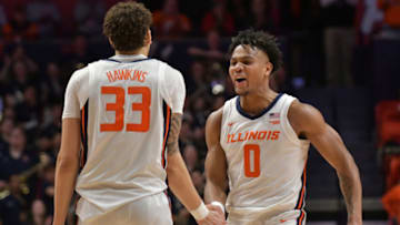 Jan 31, 2023; Champaign, Illinois, USA; Illinois Fighting Illini forward Coleman Hawkins (33) and teammate Terrence Shannon Jr. (0) celebrate during the second half at State Farm Center. Mandatory Credit: Ron Johnson-USA TODAY Sports