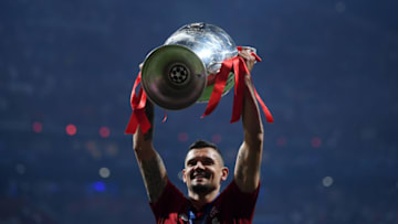 MADRID, SPAIN - JUNE 01: Dejan Lovren of Liverpool celebrates with the Champions League Trophy after winning the UEFA Champions League Final between Tottenham Hotspur and Liverpool at Estadio Wanda Metropolitano on June 01, 2019 in Madrid, Spain. (Photo by Laurence Griffiths/Getty Images)