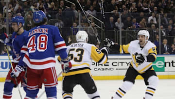 NEW YORK, NEW YORK - MARCH 25: Teddy Blueger #53 of the Pittsburgh Penguins scores a shorthanded goal at 13:12 of the second period against Alexandar Georgiev #40 of the New York Rangers and is joined by Brian Dumoulin #8 (r) at Madison Square Garden on March 25, 2019 in New York City. (Photo by Bruce Bennett/Getty Images)
