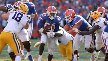 GAINESVILLE, FL - OCTOBER 07: Florida Gators running back Lamical Perine (22) breaks a tackle from LSU Tigers nose tackle Ed Alexander (95) during the college football game between the LSU Tigers and Florida Gators on October 07, 2017, at Ben Hill Griffin Stadium at Florida Field in Gainesville, FL. (Photo by Mark LoMoglio/Icon Sportswire via Getty Images)