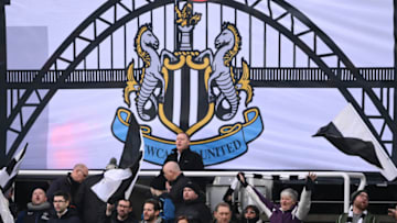 NEWCASTLE UPON TYNE, ENGLAND - JANUARY 15: A flag showing the Tyne Bridge is pictured alongside fans in the Gallowgate End during the Premier League match between Newcastle United and Watford at St. James Park on January 15, 2022 in Newcastle upon Tyne, England. (Photo by Stu Forster/Getty Images)