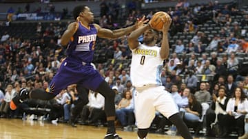 Nov 16, 2016; Denver, CO, USA; Denver Nuggets guard Emmanuel Mudiay (0) drives to the basket against Phoenix Suns guard Eric Bledsoe (2) during the second half at Pepsi Center. The Nuggets won 120-104. Mandatory Credit: Chris Humphreys-USA TODAY Sports