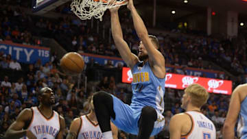 Oct 18, 2015; Oklahoma City, OK, USA; Denver Nuggets forward Joffrey Lauvergne (77) dunks the ball against the Oklahoma City Thunder during the first quarter at Chesapeake Energy Arena. Mandatory Credit: Mark D. Smith-USA TODAY Sports
