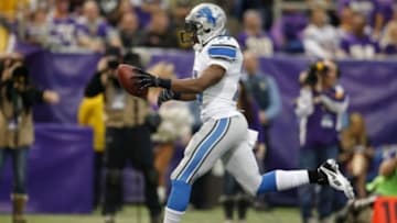 Dec 29, 2013; Minneapolis, MN, USA; Detroit Lions running back Reggie Bush (21) runs with the ball for a touchdown against the Minnesota Vikings in the third quarter at Mall of America Field at H.H.H. Metrodome. The Vikings won 14-13. Mandatory Credit: Bruce Kluckhohn-USA TODAY Sports