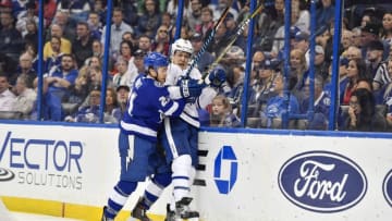 TAMPA, FL - MARCH 20: Tampa Bay Lightning center Brayden Point (21) finishes his check on Toronto Maple Leafs defender Jake Gardiner (51) during the second period of an NHL game between the Toronto Maple Leafs and the Tampa Bay Lightning on March 20, 2018, at Amalie Arena in Tampa, FL. (Photo by Roy K. Miller/Icon Sportswire via Getty Images)