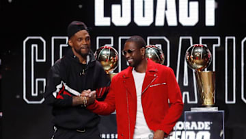Former Miami Heat player Dwyane Wade greets Udonis Haslem during the Miami Heat Dwyane Wade L3GACY Celebration at American Airlines Arena (Photo by Michael Reaves/Getty Images)