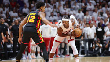 Jimmy Butler #22 of the Miami Heat is defended by De'Andre Hunter #12 of the Atlanta Hawks(Photo by Michael Reaves/Getty Images)