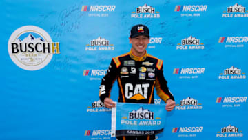 KANSAS CITY, KANSAS - OCTOBER 19: Daniel Hemric, driver of the #8 Caterpillar Chevrolet, poses with the pole award after qualifying for the Monster Energy NASCAR Cup Series Hollywood Casino 400 at Kansas Speedway on October 19, 2019 in Kansas City, Kansas. (Photo by Jonathan Ferrey/Getty Images)