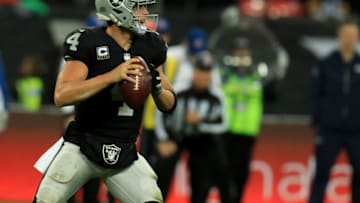 14th October 2018, Wembley Stadium, London, England; NFL in London, game one, Seattle Seahawks versus Oakland Raiders; Quarterback Derek Carr of the Oakland Raiders drops back to throw a pass (Photo by Shaun Brooks/Action Plus via Getty Images)
