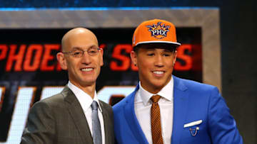 NEW YORK, NY - JUNE 25: Devin Booker meets with Commissioner Adam Silver after being selected 13th overall by the Phoenix Suns in the First Round of the 2015 NBA Draft at the Barclays Center on June 25, 2015 in the Brooklyn borough of New York City. NOTE TO USER: User expressly acknowledges and agrees that, by downloading and or using this photograph, User is consenting to the terms and conditions of the Getty Images License Agreement. (Photo by Elsa/Getty Images)