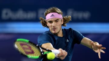 DUBAI, UNITED ARAB EMIRATES - MARCH 02: Stefanos Tsitsipas of Greece plays a shot in his Men's Singles Final match against Roger Federer of Switzerland during day fourteen of the Dubai Duty Free Championships at Dubai Duty Free Tennis Stadium March 02, 2019 in Dubai, United Arab Emirates. (Photo by Francois Nel/Getty Images)