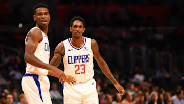 LOS ANGELES, CA - OCTOBER 09: Los Angeles Clippers Guard Shai Gilgeous-Alexander (2) looks on with Los Angeles Clippers Guard Lou Williams (23) during an NBA preseason game between the Denver Nuggets and the Los Angeles Clippers on October 9, 2018 at STAPLES Center in Los Angeles, CA.