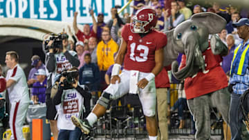 BATON ROUGE, LA - NOVEMBER 03: Alabama Crimson Tide quarterback Tua Tagovailoa (13) celebrates after rushing for a touchdown during a game between the LSU Tigers and Alabama Crimson Tide on November 3, 2018 at Tiger Stadium, in Baton Rouge, Louisiana. (Photo by John Korduner/Icon Sportswire via Getty Images)