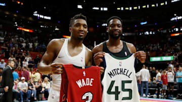 MIAMI, FL - DECEMBER 02: Donovan Mitchell #45 of the Utah Jazz and Dwyane Wade #3 of the Miami Heat exchange jerseys after the game at American Airlines Arena on December 2, 2018 in Miami, Florida. (Photo by Michael Reaves/Getty Images)