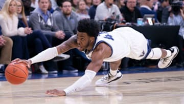 Villanova Wildcats wing/forward Saddiq Bey dives for a loose ball. (Photo by Mitchell Leff/Getty Images)