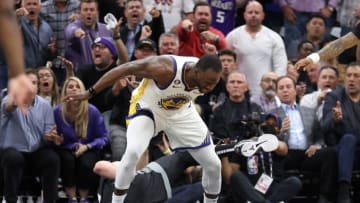 SACRAMENTO, CALIFORNIA - APRIL 17: Draymond Green #23 of the Golden State Warriors steps over Domantas Sabonis #10 of the Sacramento Kings in the second half during Game Two of the Western Conference First Round Playoffs at Golden 1 Center on April 17, 2023 in Sacramento, California. Green was issued a flagrant foul 2 on the play, and ejected from the game. NOTE TO USER: User expressly acknowledges and agrees that, by downloading and or using this photograph, User is consenting to the terms and conditions of the Getty Images License Agreement. (Photo by Ezra Shaw/Getty Images)