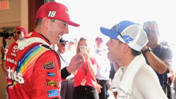 JOLIET, IL - JULY 01: Kyle Busch, driver of the #18 Skittles Red White and Blue Toyota, speaks with Kyle Larson, driver of the #42 Credit One Bank Chevrolet (Photo by Jared C. Tilton/Getty Images)