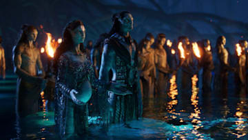 (L-R): Ronal, Tonowari, and the Metkayina clan in 20th Century Studios' AVATAR: THE WAY OF WATER. Photo courtesy of 20th Century Studios. © 2022 20th Century Studios. All Rights Reserved.