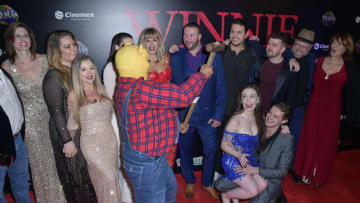 MEXICO CITY, MEXICO - JANUARY 24: Andrew Scott, Natasha Tosini, Danielle Ronald, María Taylor, Vince Knight, Scott Jeffrey, Rhys Frake-Waterfield, Amber Doig-Thorne, Nikolai Leon, Craig David and Danielle Scott pose for a photo on the red carpet during the premiere of "Winnie The Pooh Blood and Honey" at Cinepolis Artz on January 24, 2023 in Mexico City, Mexico. (Photo by Jaime Nogales/Medios y Media/Getty Images)