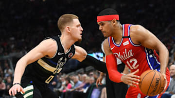 MILWAUKEE, WISCONSIN - FEBRUARY 06: Tobias Harris #12 of the Philadelphia 76ers is defended by Donte DiVincenzo #0 of the Milwaukee Bucks during a game at Fiserv Forum on February 06, 2020 in Milwaukee, Wisconsin. NOTE TO USER: User expressly acknowledges and agrees that, by downloading and or using this photograph, User is consenting to the terms and conditions of the Getty Images License Agreement. (Photo by Stacy Revere/Getty Images)