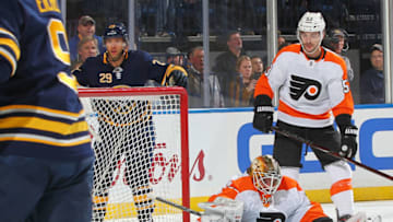 BUFFALO, NY - NOVEMBER 21: Jason Pominville #29 of the Buffalo Sabres along with Alex Lyon #34 and Shayne Gostisbehere #53 of the Philadelphia Flyers react to a goal by Jeff Skinner #53 (not shown) of the Sabres during an NHL game on November 21, 2018 at KeyBank Center in Buffalo, New York. (Photo by Stephanie Wippert/NHLI via Getty Images)