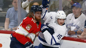 SUNRISE, FL - MARCH 23: Marc Staal #18 of the Florida Panthersand Alexander Kerfoot #15 of the Toronto Maple Leafs battle along the boards at the FLA Live Arena on March 23, 2023 in Sunrise, Florida. (Photo by Joel Auerbach/Getty Images)