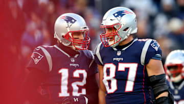FOXBOROUGH, MASSACHUSETTS - JANUARY 13: Tom Brady #12 of the New England Patriots and Rob Gronkowski #87 react during the third quarter in the AFC Divisional Playoff Game against the Los Angeles Chargers at Gillette Stadium on January 13, 2019 in Foxborough, Massachusetts. (Photo by Maddie Meyer/Getty Images)