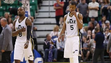 Apr 8, 2016; Salt Lake City, UT, USA; Utah Jazz guard Shelvin Mack (8) and guard Rodney Hood (5) reacts after Los Angeles Clippers guard Jamal Crawford (11) hit the go ahead shot in overtime at Vivint Smart Home Arena. The Los Angeles Clippers defeated the Utah Jazz 102-99 in overtime. Mandatory Credit: Jeff Swinger-USA TODAY Sports
