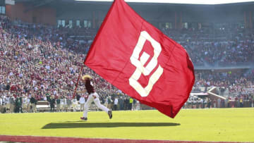 NORMAN, OK - NOVEMBER 12: A member of the Oklahoma Sooners spirit squad celebrates a touchdown against the Baylor Bears November 12, 2016 at Gaylord Family-Oklahoma Memorial Stadium in Norman, Oklahoma. Oklahoma defeated Baylor 45-24. (Photo by Brett Deering/Getty Images)