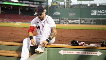 BOSTON, MA - SEPTEMBER 1: Michael Chavis #23 of the Boston Red Sox ties his shoes before a game against the Atlanta Braves on September 1, 2020 at Fenway Park in Boston, Massachusetts. (Photo by Billie Weiss/Boston Red Sox/Getty Images)