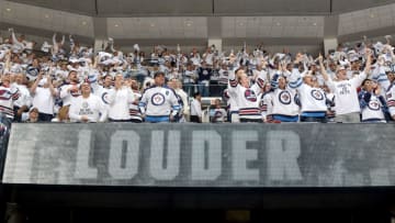WINNIPEG, MB - APRIL 13: Winnipeg Jets fans rise to their feet and cheer during a third period stoppage in play between the Jets and the Minnesota Wild in Game Two of the Western Conference First Round during the 2018 NHL Stanley Cup Playoffs at the Bell MTS Place on April 13, 2018 in Winnipeg, Manitoba, Canada. (Photo by Jonathan Kozub/NHLI via Getty Images)